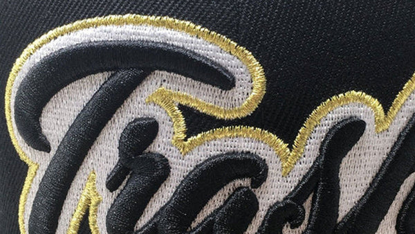 Black cap with 'Thrash' logo in 3D on a black background