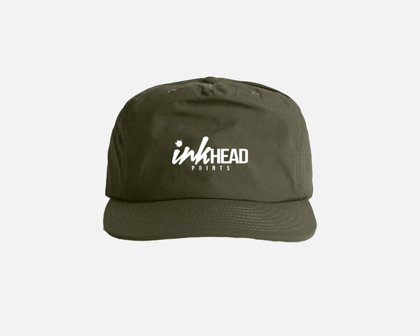 Green cap with 'inkHEAD Prints' logo on a white background