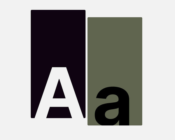 Black and white 'A' and green and black 'a' on a light gray background